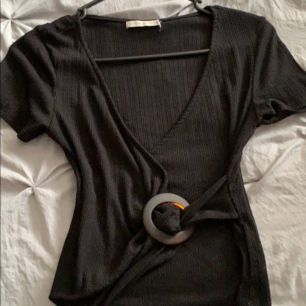 Black tee v neck with a tie around the waist